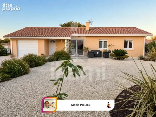 Maison de plain-pied avec 3 chambres, garage et jardin arboré de 818 m2
