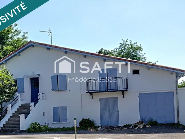 Maison T6 125m² avec garages et jardin de 2200m².