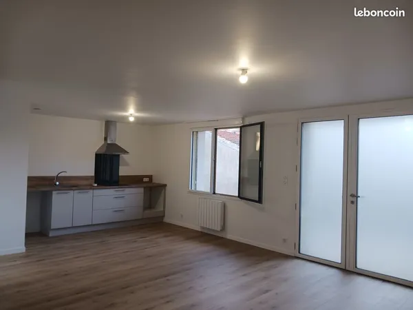 Appartement T3 avec terrasse et place de stationnement