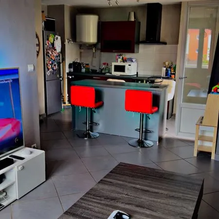Appartement 57 m² - 2 chambres - Balcon - Centre-ville - Ascenseur - Parking