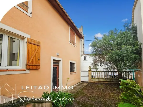 Maison de ville avec garage et jardin
