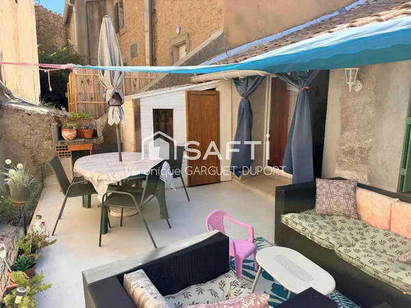 Immeuble avec local commercial et logement avec terrasse