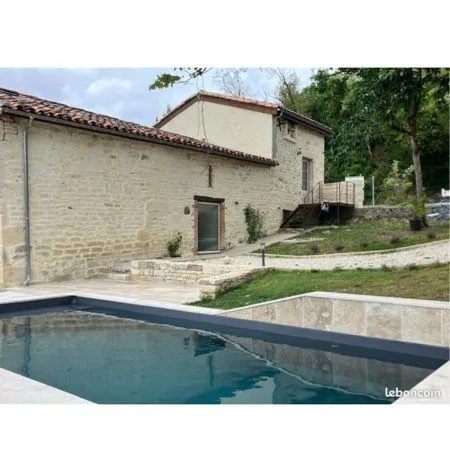 Grange rénovée avec piscine + terrain constructible
