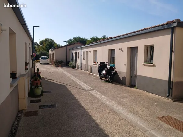 Maison dans résidence