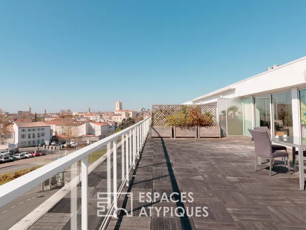 Penthouse lumineux à la vue panoramique et son garage XXL