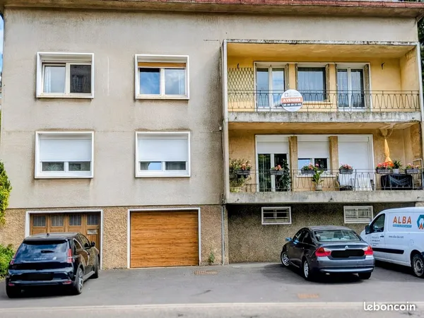Appartement T5 avec balcon, garage, caves et jardin privatif