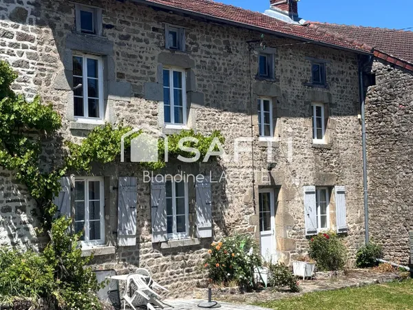Maison mitoyenne en pierre, terrain et dépendance
