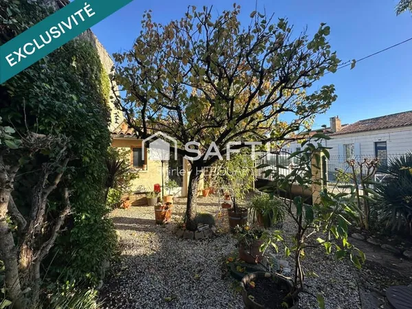 Échoppe double réunie avec jardin, véranda et abri
