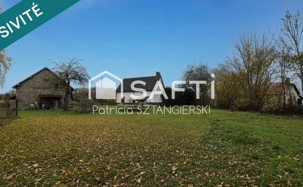 Maison en pierres au calme avec garage et terrain clos.