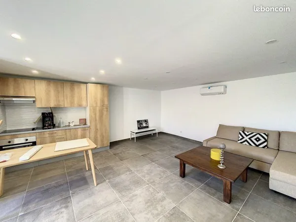 Bas de villa type 2 de 55 m2 avec une place de parking