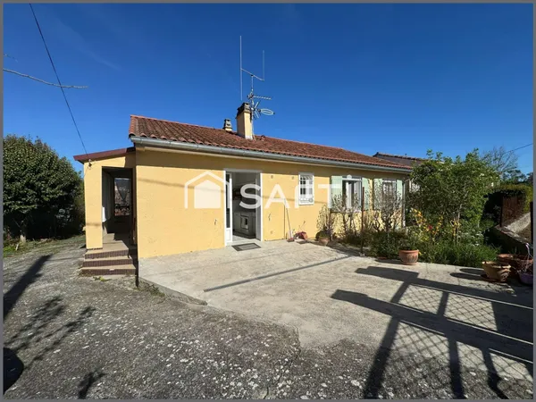 Maison avec jardin , garage et un atelier, des commodités juste à pied !