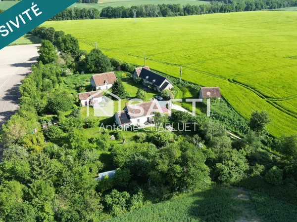Ancienne ferme de 130m² avec terrain arboré de 9 330 m², nombreuses dépendances et potentiel tourist