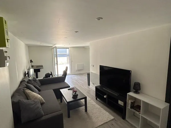 Appartement 56 m² avec jardin, grand garage et 2 stationnements
