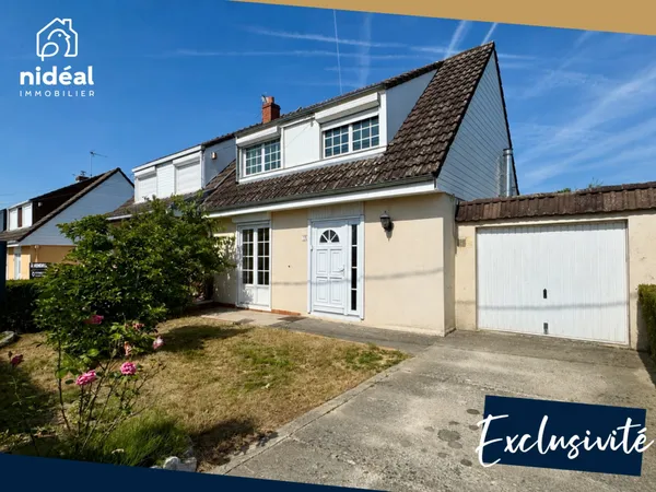 Masion semi-individuelle avec garage et jardin à améliorer