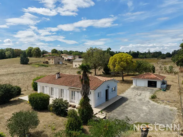A Vendre Maison de plain-pied de 136 m² avec double garage sur terrain arboré d'environ 4 800 m²