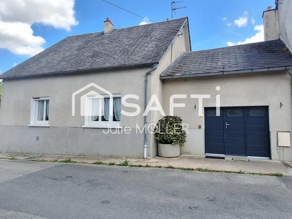 Maison avec garage et jardin à fort potentiel
