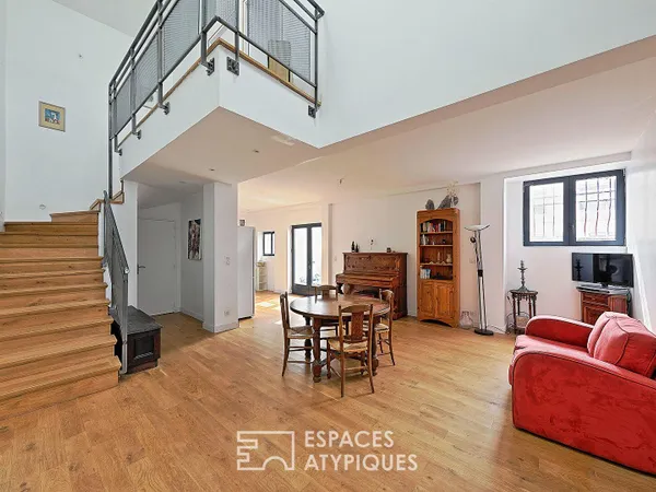 Esprit factory et volumes spectaculaires pour ce loft avec jardin privatif