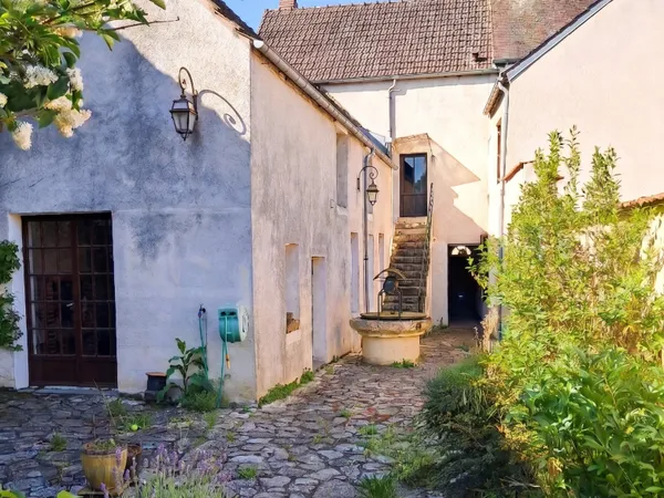 Maison comprenant trois logements