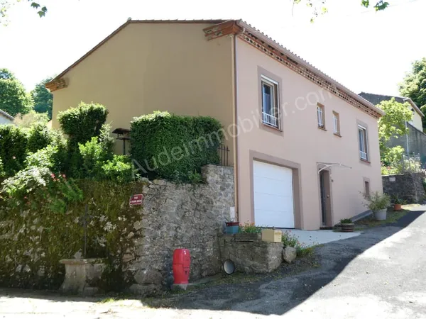 Maison avec garage et jardin