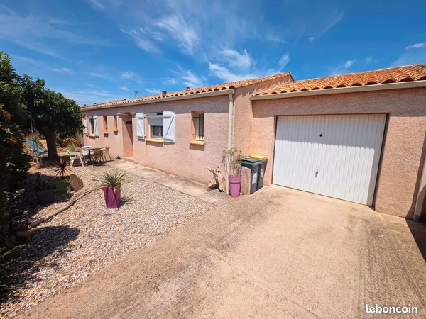 Maison avec garage et jardin