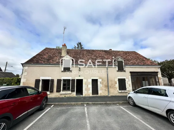Maison avec beau potentiel locatif.