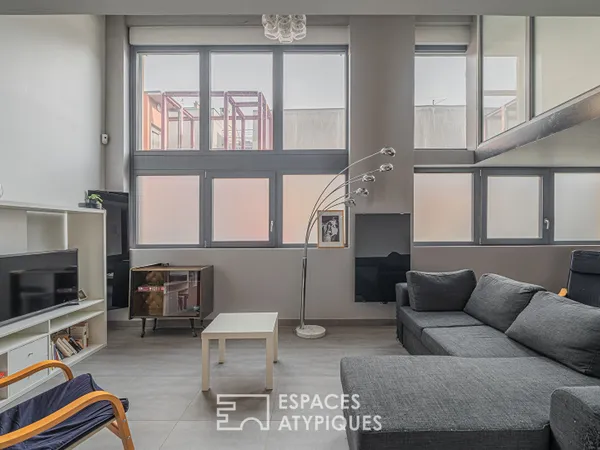 Appartement loft en duplex et petite terrasse coté cour 77 m2
