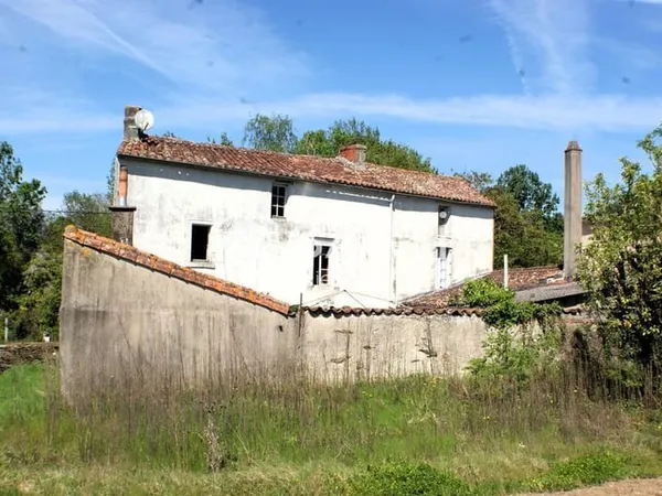 Ensemble de 2 maisons et un terrain constructible