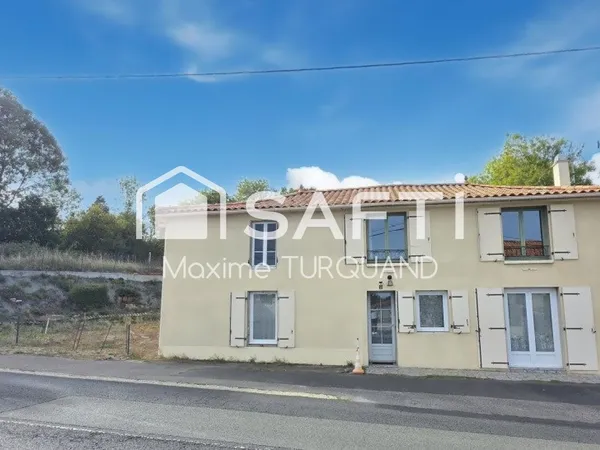 Maison 115m², 2/3chambres, 400m² de terrain avec garage.