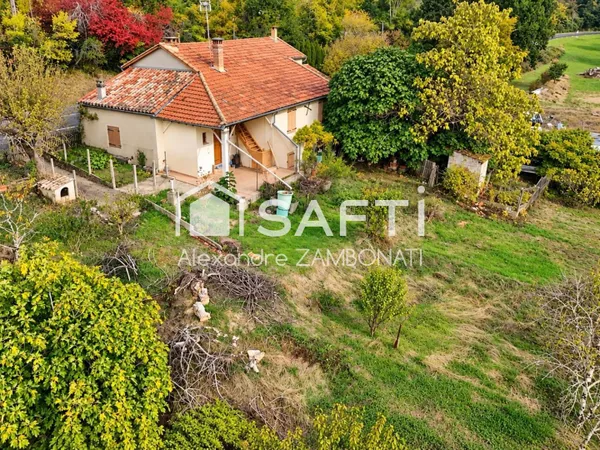 Maison de 105 m² avec garage, jardin et terrains boisés à Malause
