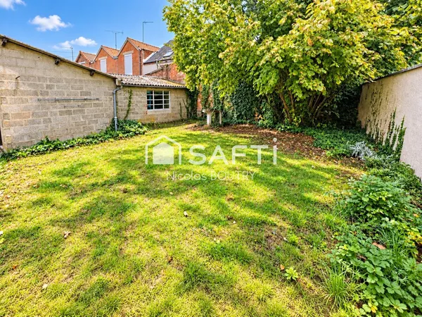 Maison familiale avec jardin, garage et atelier