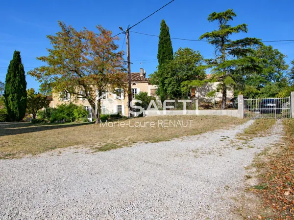 Propriété d'exception avec double habitation, piscine et terrain arboré