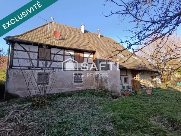 Maison de caractère avec beau potentiel
