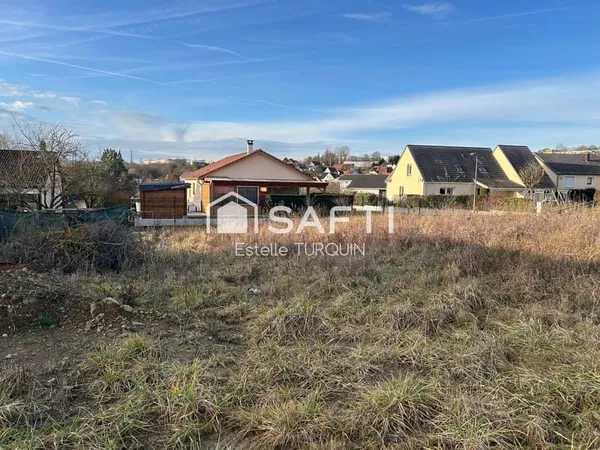Terrain plat de presque 6 ares dans lotissement récent