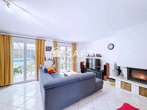 Maison familiale 4 chambres, véranda chauffée, garage et jardin.