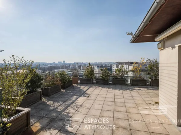 T4 TRAVERSANT DERNIER ETAGE 53M2 DE TERRASSES ET 2 PARKINGS