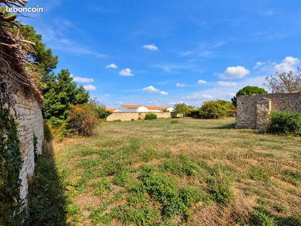 Terrain 1 073 m² Marsilly centre - Permis villa 200 m² + piscine en cours