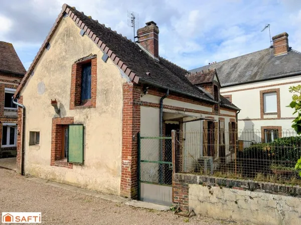 Maison de plain-pied à rénover avec jardin et garage