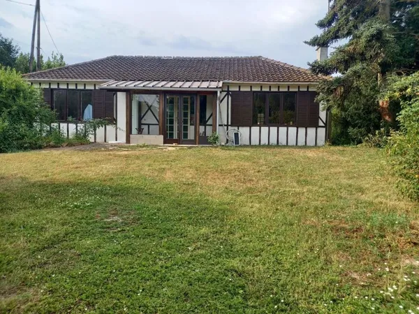 Maison sur terrain + étang