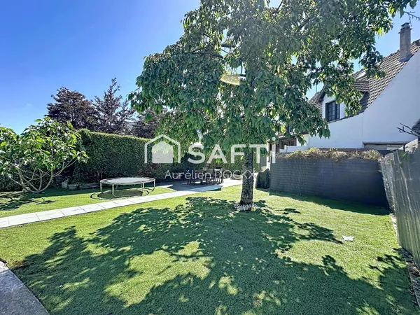 Spacieuse maison avec garage et agréable jardin