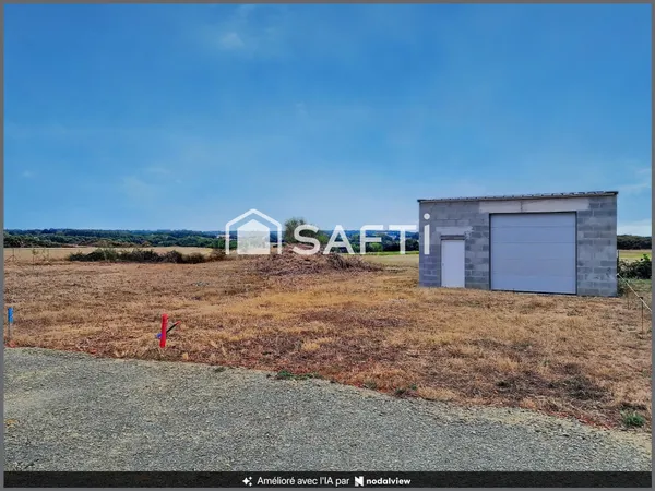 Beau terrain à bâtir avec grand garage déjà édifié