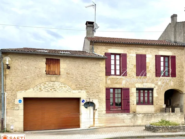 Maison en pierres avec garage et jardin