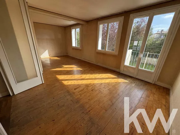 Appartement T3 avec balcon, cave et garage