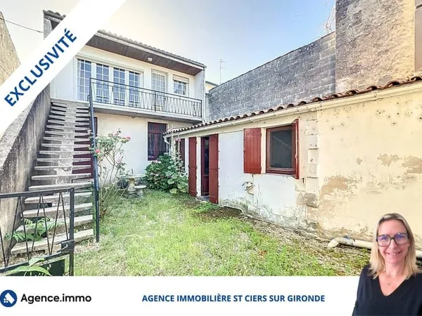 Maison avec un local pro loué et garages