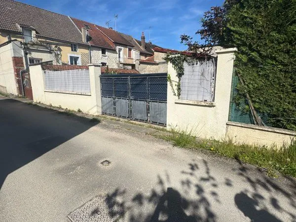 Vends garage avec terrain transformable en habitation