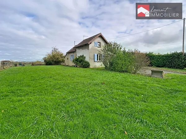Maison pleine de potentiel sur belle parcelle de terrain
