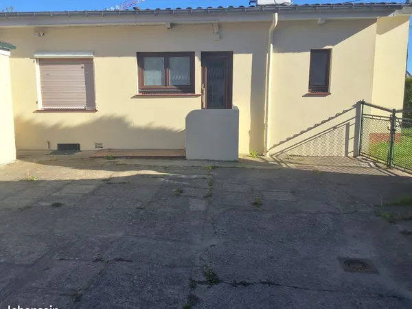 Maison de 65m² avec garage et terrain constructible