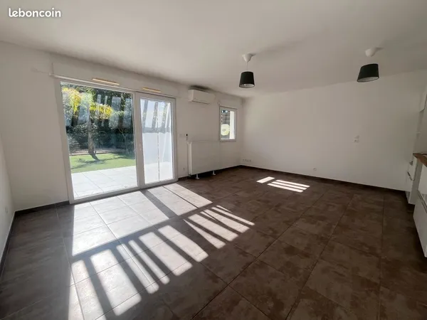 T3 rez de jardin + parking
