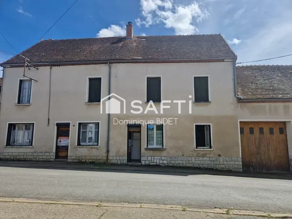 Maison double avec cour intérieure. 3 garages.