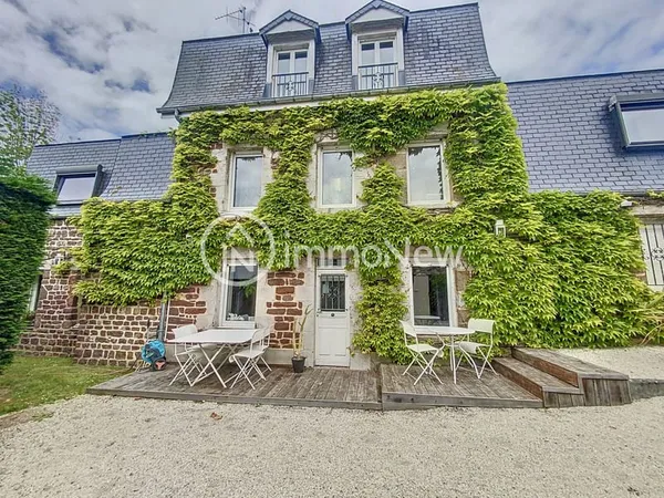 MAISON DE CHARME A YQUELON AVEC PISCINE CHAUFFEE ET JARDIN.