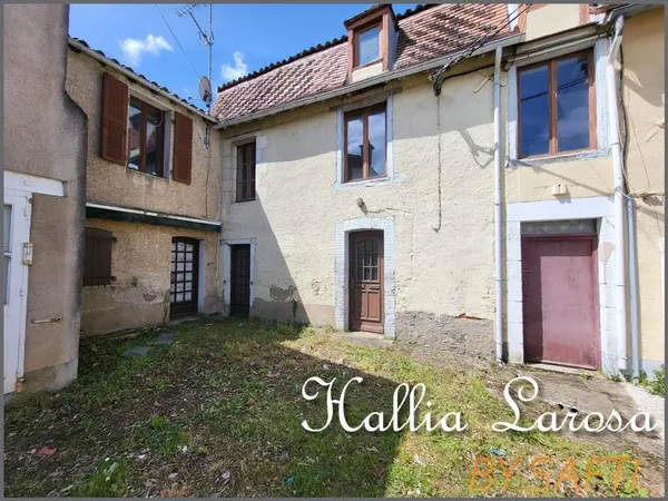 Ensemble immobilier avec garage et jardin